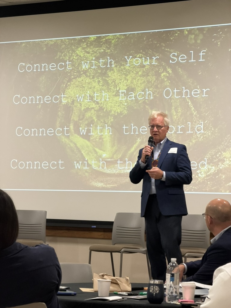 Patrick Hanaway presenting on connecting with self, each other, the world, and the land